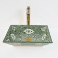 Lavabo artisanal marocain en céramique peint à la main, couleur vert émeraude.