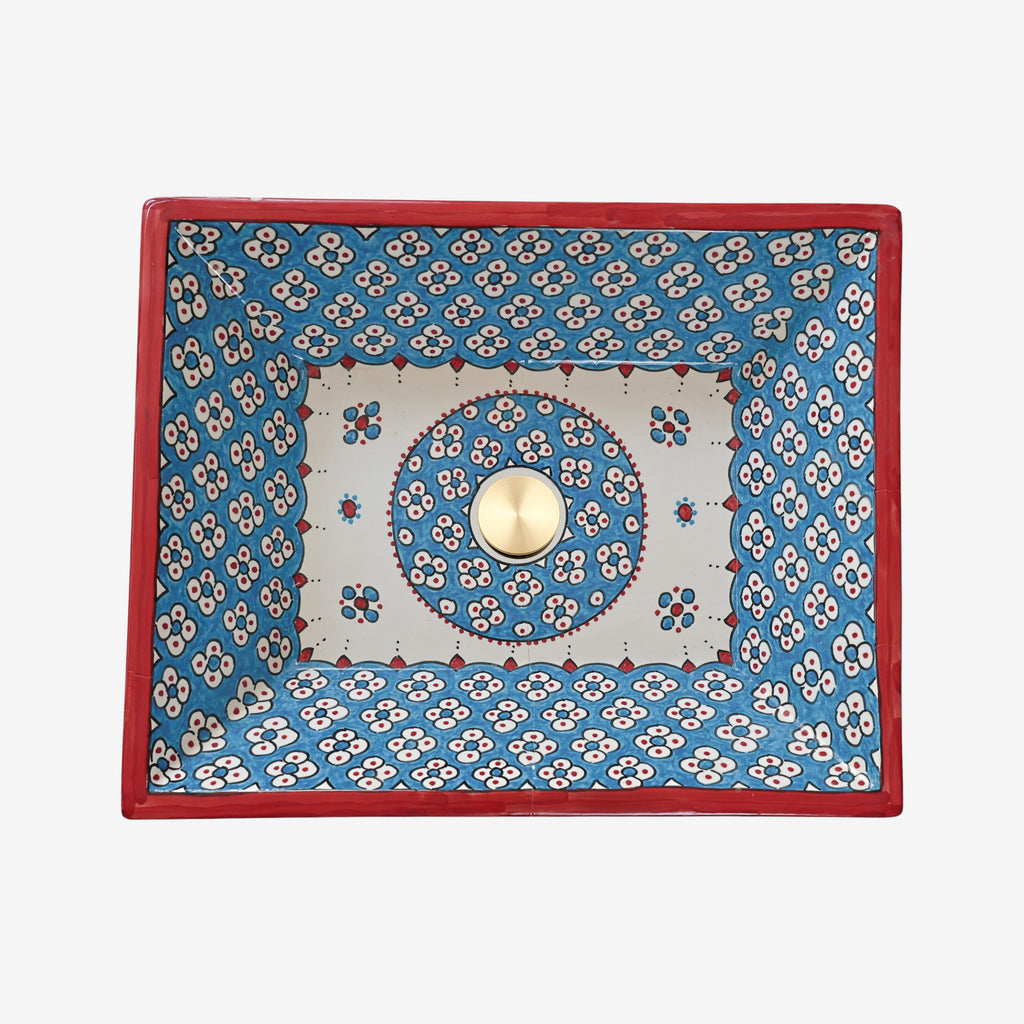 Vasque à poser design bicolore bleu ciel et rouge vif, style artistique contemporain pour salle de bain Maroc.
